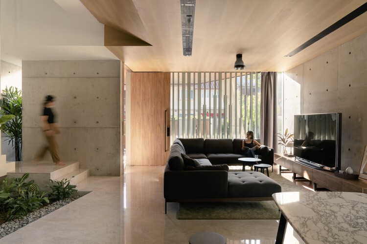 Дом в Терубоке / CDG Architects — фотография интерьера, гостиная, диван