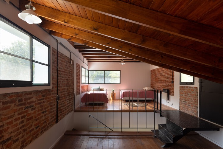 Загородный дом в Пиле / DRM Arquitectura - Фотография интерьера, окна, балка