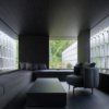 Angled concrete blocks screen home in Japanese forest by Nendo